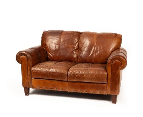 A modern leather two-seater sofa, 150cm wide, 90cm deep, 79cm high CONDITION REPORT: Condition information is not usually pro