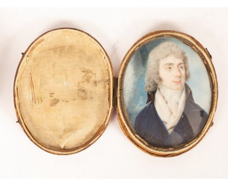 Two Georgian portrait miniatures of gentleman, watercolours on ivory, head and shoulders portraits both wearing blue coats, 7