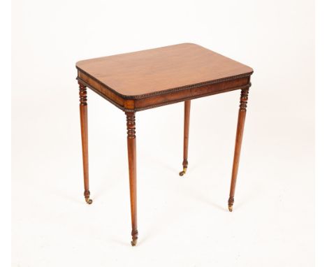 A Regency mahogany centre table with beaded edges, on ring turned tapering legs and castors, 65cm wide, 49.5cm deep, 72cm hig