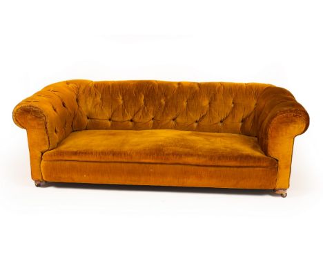 A Chesterfield sofa upholstered in dark ochre velvet, on castors, approximately 197cm wide x 100cm deep  CONDITION REPORT: Co