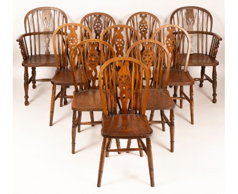 A pair of pierced splat and stick back armchairs with solid seats, together with eight wheel back single chairs (10)All over 