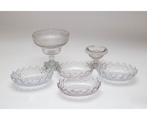 A circular cut glass footed bowl with diamond, foliate and scale decoration on a lemon-squeezer base, 21cm high, together wit