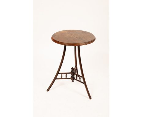 A late 19th Century Thonet style bentwood tripod table, the circular moulded edge top above outswept legs joined by bobbin tu