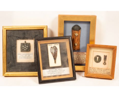 Four framed trove discoveries, harness mounts, arrow head, dagger mounts, etc. CONDITION REPORT: Condition information is not
