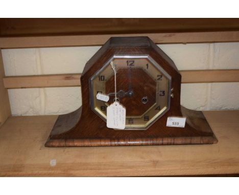 An Art Deco oak cased mantel clock
