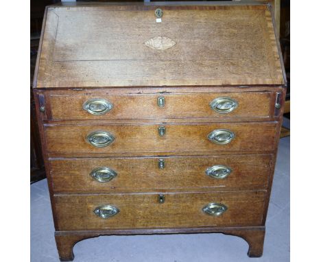 An 18th century Georgian country made fall front bureau with crossbanded decoration and shell inlay to the flap, having fitte