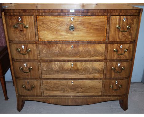 A Regency inlaid mahogany 'D' front secretaire chest with central fitted satinwood section flanked by 2 short shaped drawers,