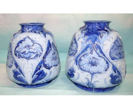 A James MacIntyre & Co pair of blue Florian vases of wide top form on arc foot, decorated with poppies, designed by William M