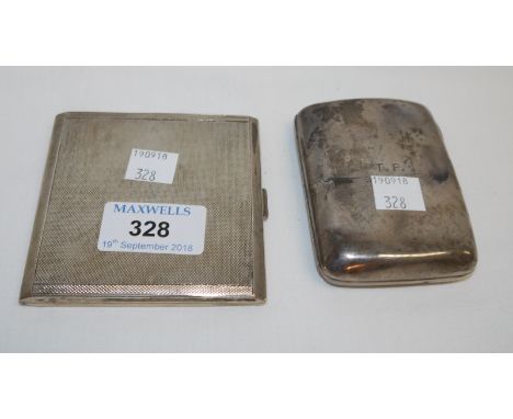 A silver engine turned cigarette case, Birmingham 1941; a silver cigarette case, monogrammed, Birmingham 1891 (dented), 6½ oz