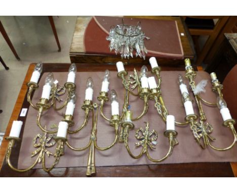 A small chandelier style light shade with faceted lustre drops; a selection of triangular lustre drops; a set of 4 brass peri