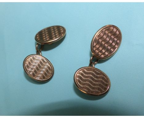 A pair of 9 carat hallmarked gold oval cufflinks, engine turned, 13.5 gm