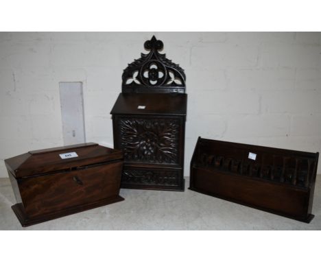A 19th century sarcophagus shaped tea caddy; a Black Forest style wall hanging candle box; a cutlery rack