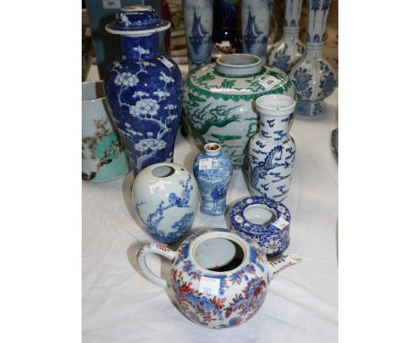 A Chinese blue and white vase of inverted baluster column form, height 11½" (finial missing); a Chinese ginger jar style vase