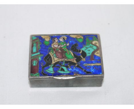 A small white metal patch box with enamel decoration