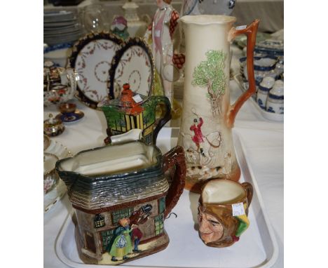 A Royal Doulton tall jug with hunting scene in relief, a Royal Doulton 'Old couriosity shop' jug, three other peices