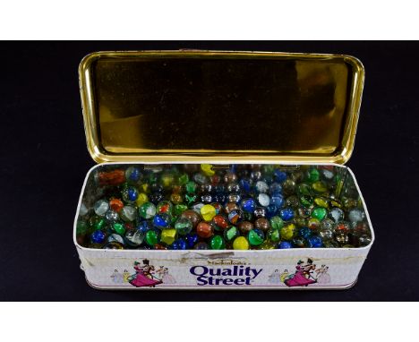 Tin of old vintage marbles
