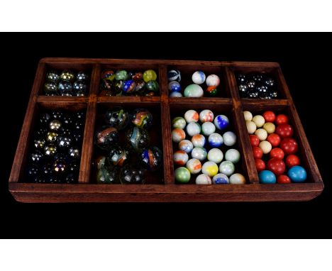 Box of old vintage marbles, sorted into types