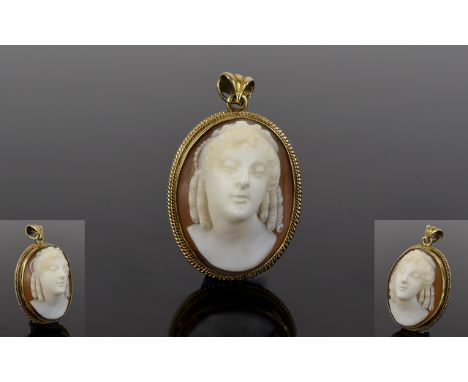 9ct Gold Mounted Oval Shaped Cameo with Portrait Bust of a Young Victorian Lady. Marked 9ct. 1.25 Inches High. Good Condition