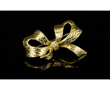 18ct Gold Bow Brooch. Polished and Bark Effect Finish to Brooch. Fitted and Bark Effect Finish to Brooch. Fitted with Pin and