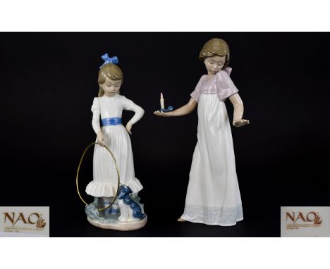 Nao by Lladro Figures ( 2 ) In Total. Comprises 1/ Girl In Night Dress Holding a Candle. 10.5 Inches High. 2/ Young Girl with