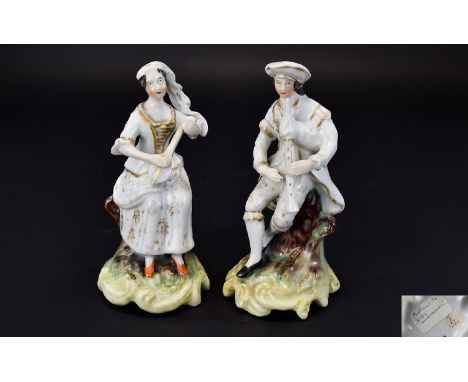 Staffordshire Pair of Musician Figures, each wearing detailed clothes in gilt on white and seated on a tree trunk, the lady p