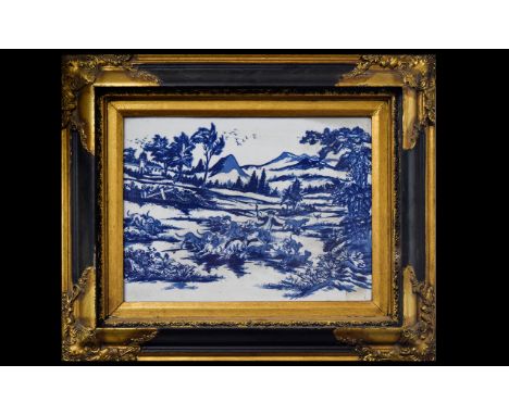 A Framed Chinese Ceramic Tile In The Dutch Style Blue and white 20th century Chinese tile depicting a rural hunting scene. Ho