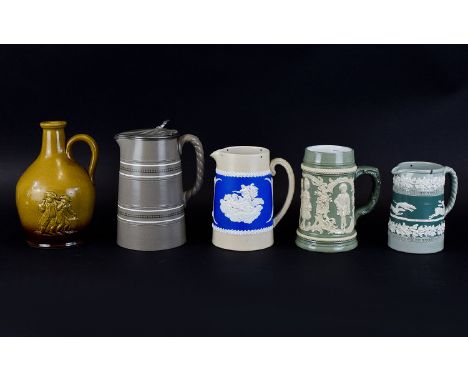 Musterschutz, Dudson and Other Stoneware Jugs, the Musterschutz in celadon green with pate-sur-pate style decoration of child