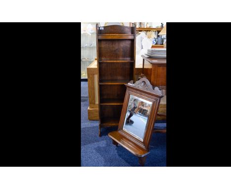 A Small Oak Bookshelf Wall mounted bookself with five shelves in aged oak. Also a bevelled glass mirror in wood surround with