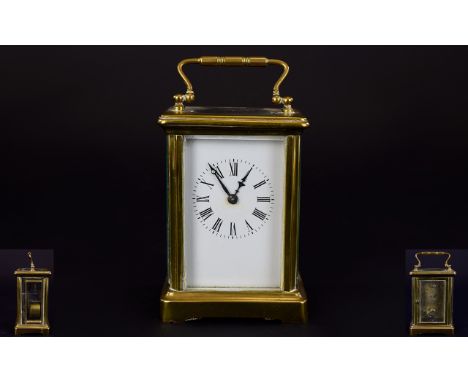 English Late 19th Century Brass Carriage Clock with Visable Escapement Glass Panels. White porcelain dial circa 1890-1900. 5 