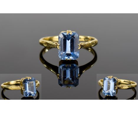 18ct Yellow Gold Single Stone Set Blue Spinel Dress Ring. Marked 18ct. Ring Size - P. The Step-cut Blue Spinel of Est 1ct. 