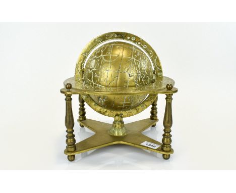 A Vintage Solid Brass Globe Decorative globe with zodiac engraved equator ring and x frame base. Good condition, 10 inches hi