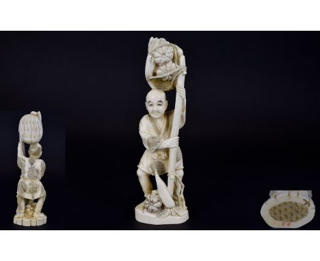 Japanese Early 20th Century Okimono Carved Ivory Figure. Signed In Red to underside of Figure. Depicts a Japanese Man Carryin