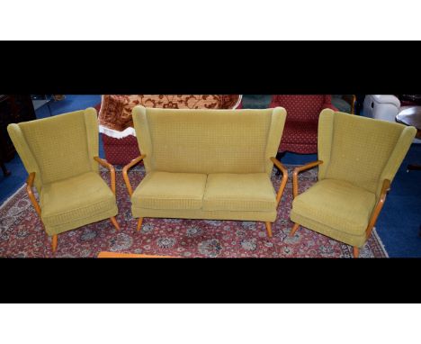 A Mid Century Scandinavian Style Three Piece Suite Comprises wing back generous two seater sofa and two matching arm chairs. 