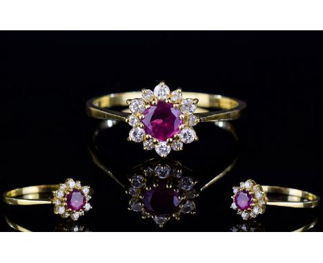 18ct Gold Dress Ring, Set With A Central Ruby Surrounded By  Small Round Cut Diamonds, Fully Hallmarked