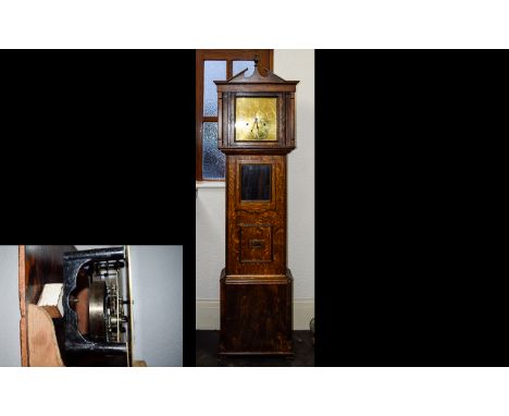 Arts and Crafts Style Oak Cased Long case Clock - Pendulum Driven. The Front of Clock with Glass Panel and Below Another Wood