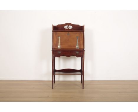 AN ARTS AND CRAFTS MAHOGANY BUREAU BOOKCASEearly 20th century, hinged drop down front decorated with metal strapwork, one dra