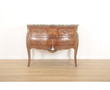AN ORMOLU MOUNTED KINGWOOD COMMODE OF LOUIS XV DESIGNof serpentine outline, with grey veined marble top, fitted two short and