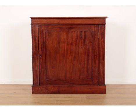 A FIGURED MAHOGANY PIER CABINETmid-19th century, the recessed door before a single shelf within, terminating on block plinth 