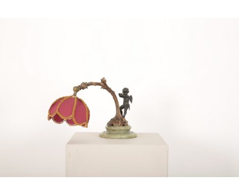 A LAMP WITH SPELTER CHERUB ATOP FOLIATED BASElate 19th century, possibly for piano, 34cm high x 32cm (excluding shade)