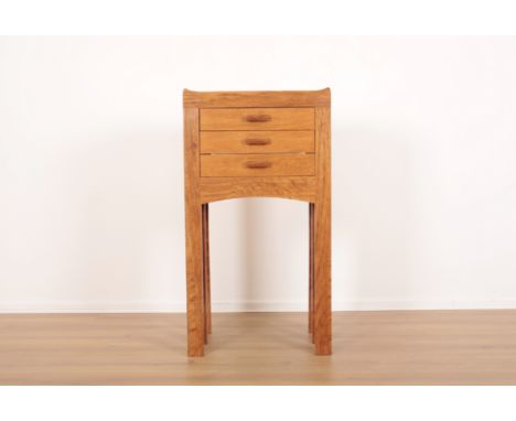A 20TH CENTURY LIGHT OAK CHEST OF DRAWERS OF SMALL PROPORTIONfitted three drawers, 107cm high x 58cm wide