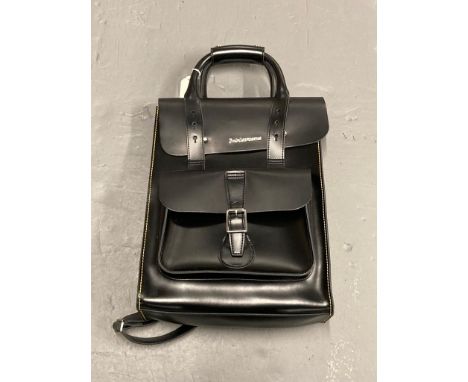 A Dr Martens laminated black leather multi-function holdall, un-used. CONDITION REPORT: Light scratch on back.