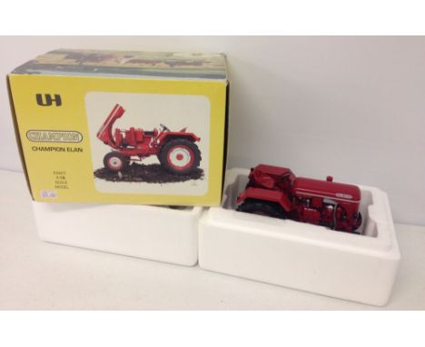 A boxed Universal Hobbies 1:16 scale Champion Elan tractor