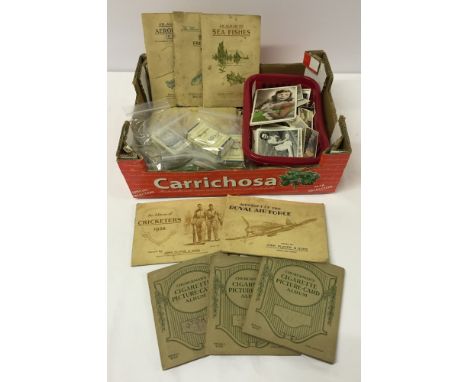 A quantity of vintage cigarette cards to include part and near complete sets, loose cards and albums.