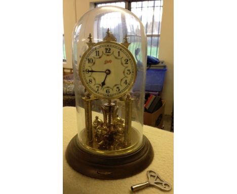 A 400 day anniversary clock by Schatz of Germany. Under a glass dome, believed to be in working order.