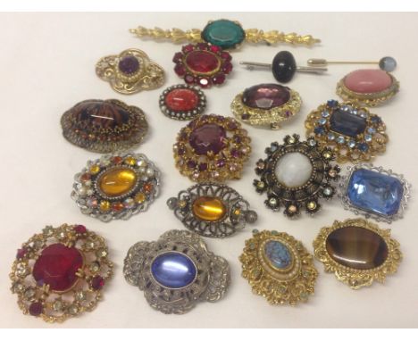 A collection of vintage costume jewellery brooches set with large central stones and coloured diamantes.