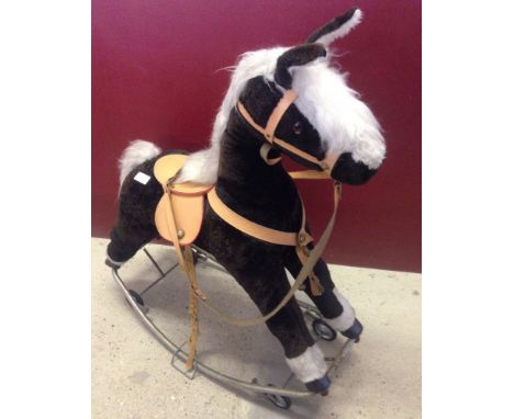 Vintage rocking horse with rockers & wheels. Dark brown & white plush fur.