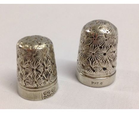 2 vintage engraved white metal thimbles.