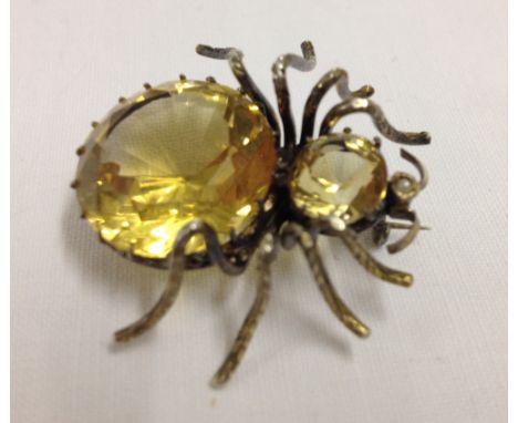 A costume jewellery spider brooch, body made of 2 citrines with a seed pearl set into the head