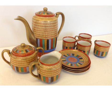 An original Art Deco Japanese coffee set by Yokoi-Sei-ichi Shoten in the 'Thousand Faces' pattern. Comprising coffee pot, cre