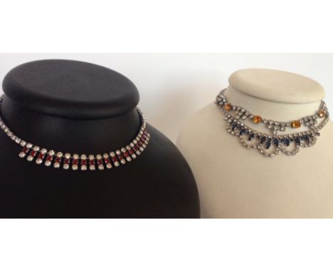 3 vintage evening necklaces, one set with red and white diamante stones, one set with golden and white past stones, and the o